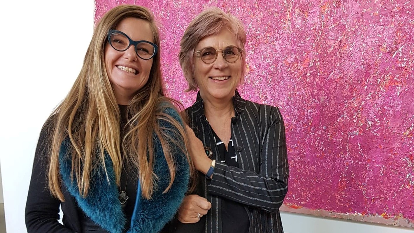 Sarah Elson and Michele Theunissen in front of Michele's work, Pink Crust