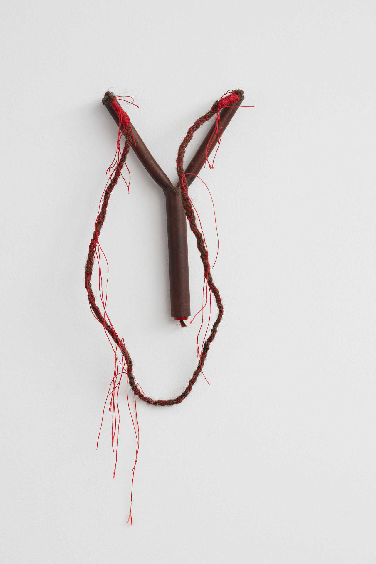 Olga Cironis, This Space Between Us is Bursting, 2018, repurposed metal sling shot, hair and cotton thread, 54 x 15 x 2.5cm
