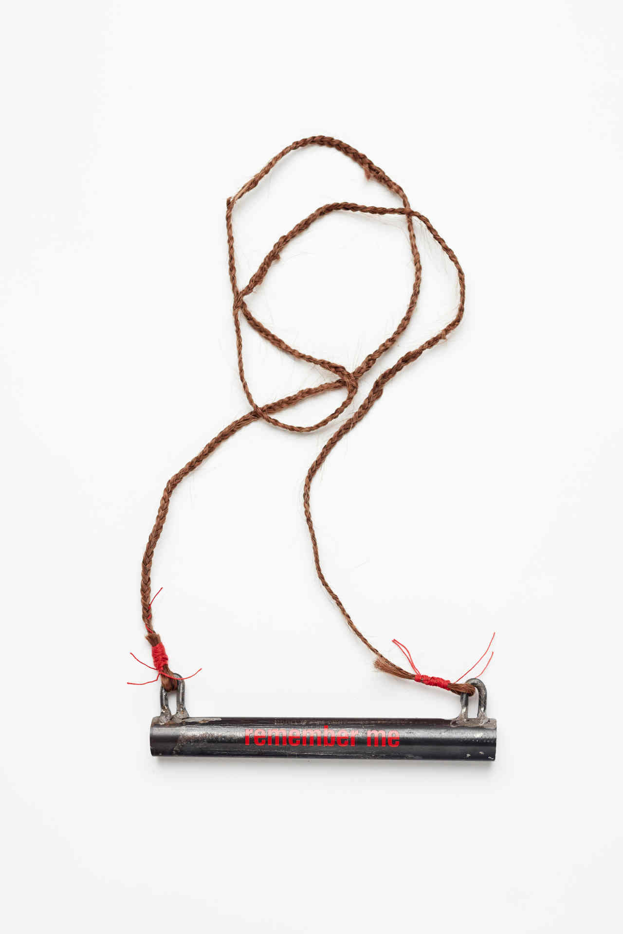 Olga Cironis, Remember Me, 2016, repurposed gun barrel, hair and cotton thread, 65 x 16 x 1.8cm