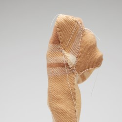 Olga Cironis, Water Bearer, 2013, ceramic ornament, woollen blanket and cotton thread, 40 x 13 x 10.5cm