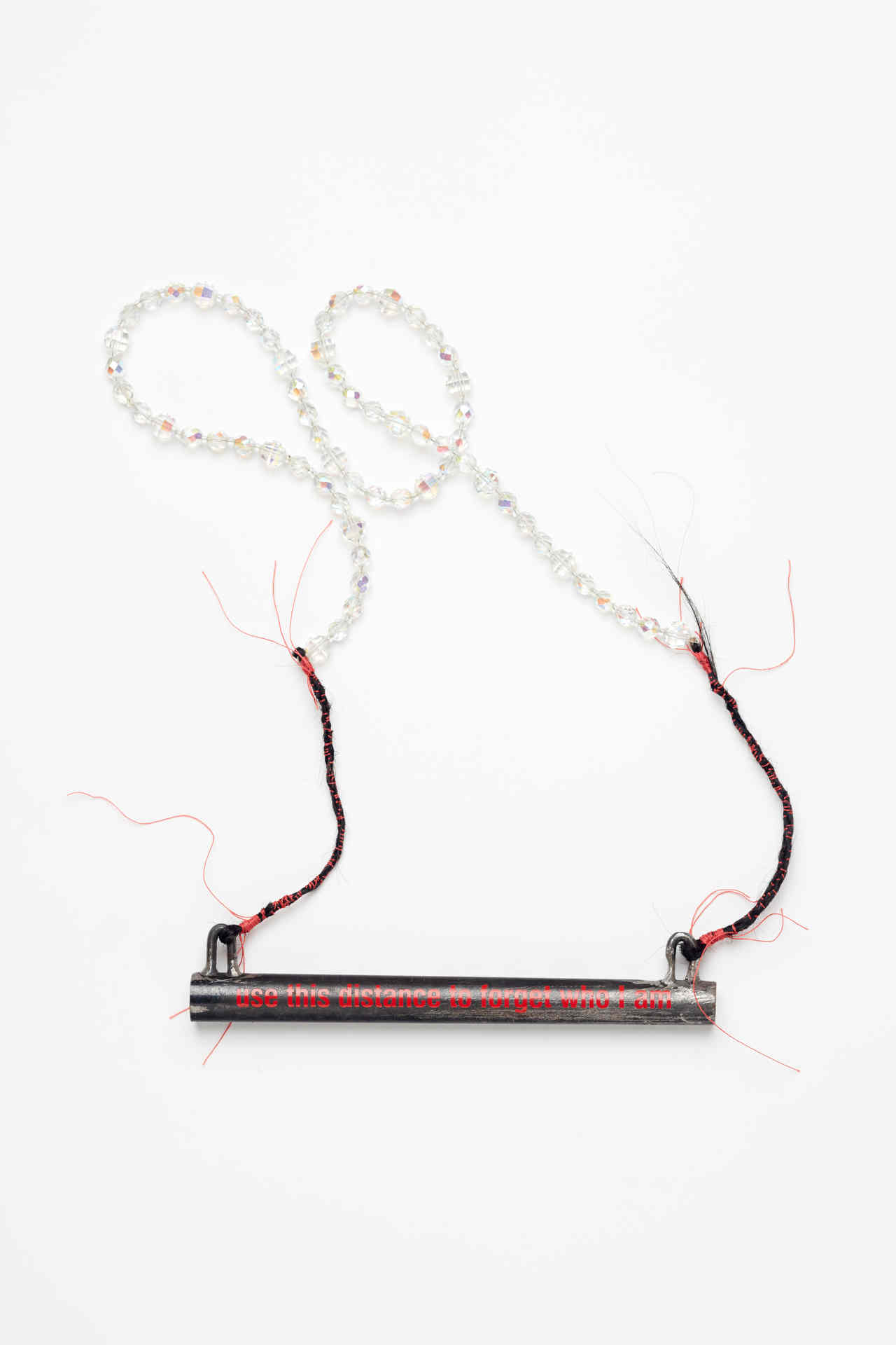 Olga Cironis, Use this Distance to Forget Who I Am, 2016, gun part, crystal, hair and thread, 49 x 20 x 1.8cm