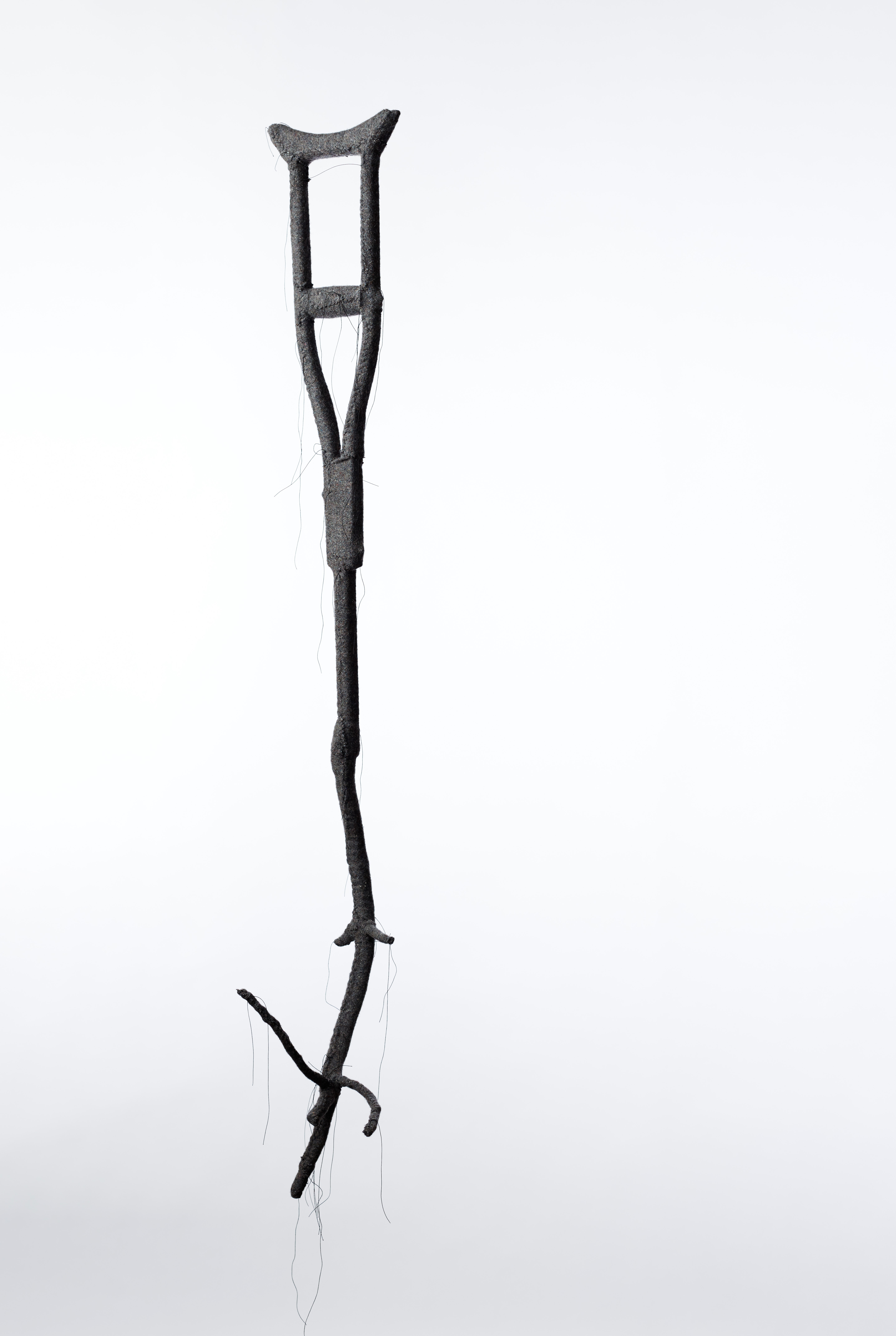 Olga Cironis, Handmaiden II, 2019, repurposed children's crutch, wood, woollen blankets and cotton thread, 150 x 23 x 29cm