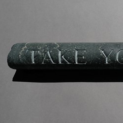 Lee Harrop, Take Your Time, 2021, hand-engraved geological core sample (from the Goldfields, Yilgarn Craton, WA), 37 x 4cm, 1.45kg