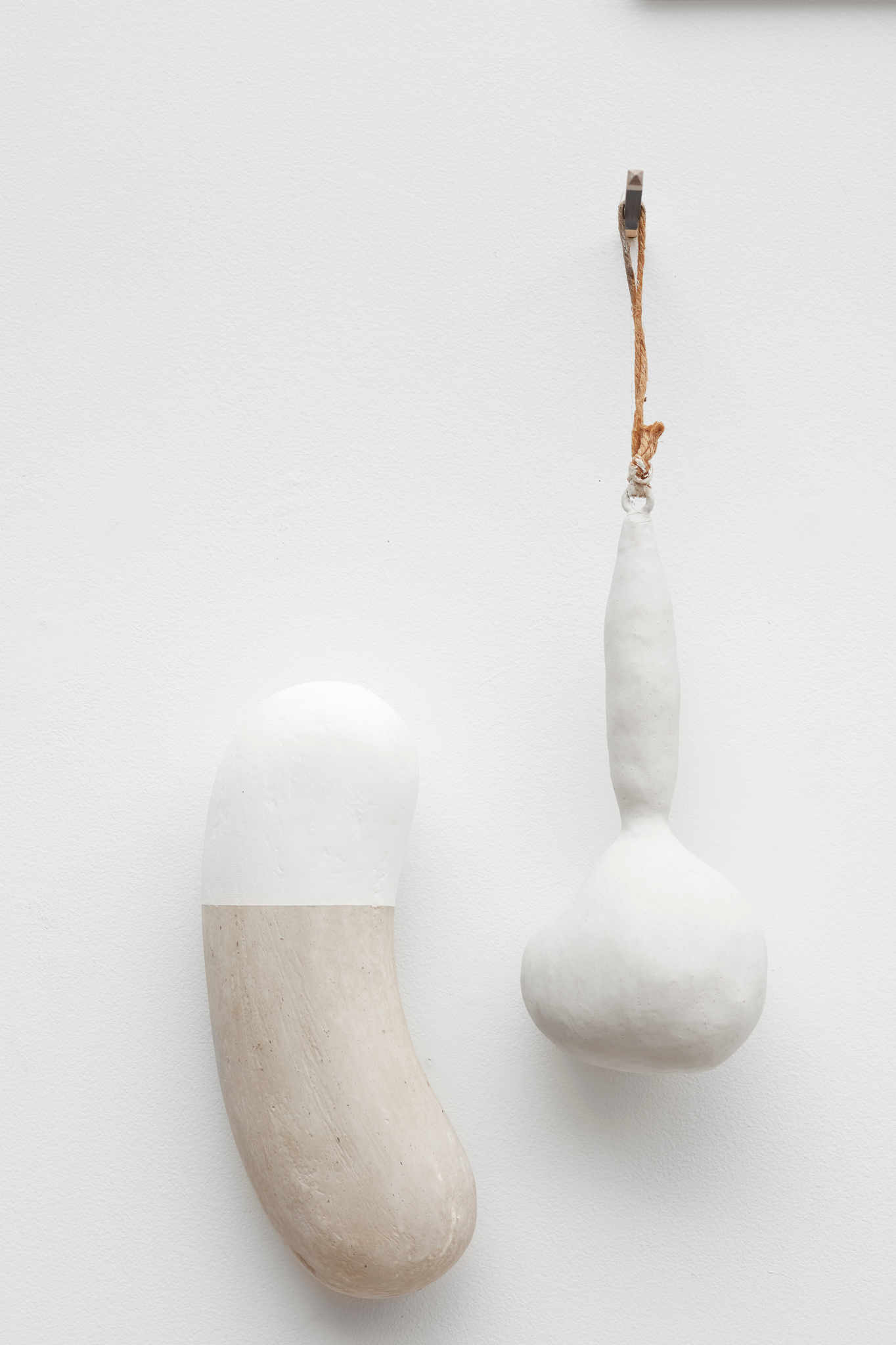 Theo Koning, Untitled 2, 2019, gesso and olive sap on plaster, 29 x 10 x 7cm and Theo Koning, Untitled 3, 2019, gesso and olive sap over tape, 39 x 12 x 9cm