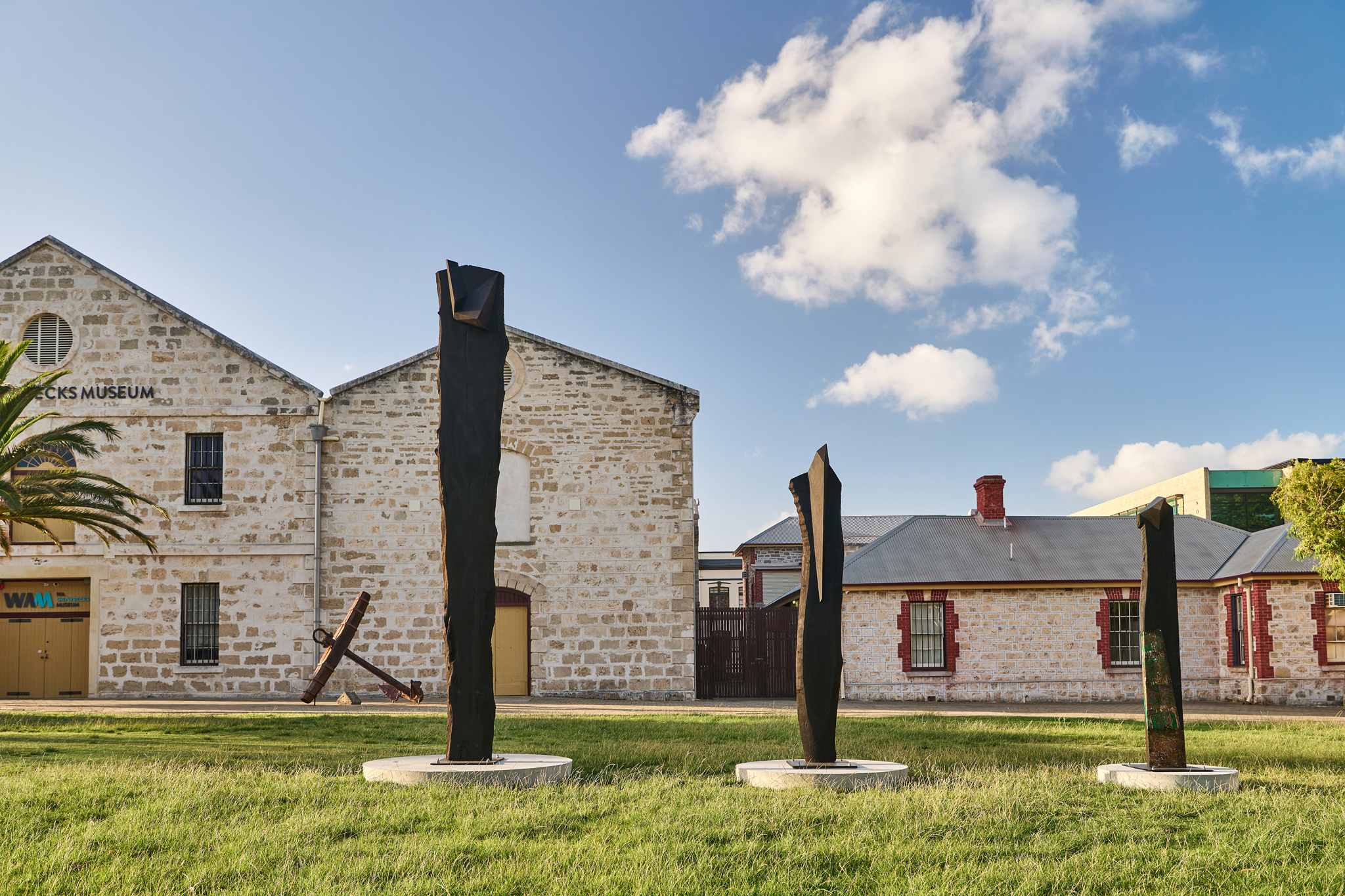 Jon Tarry, Sitting out the back - one, two & three, 2022, carbonised Jarrah, recycled olive oil tins, 420 x 50 x 60, 320 x 50 x 60, 220 x 50 x 60 cm. Sponsored by Kakulas Sister.