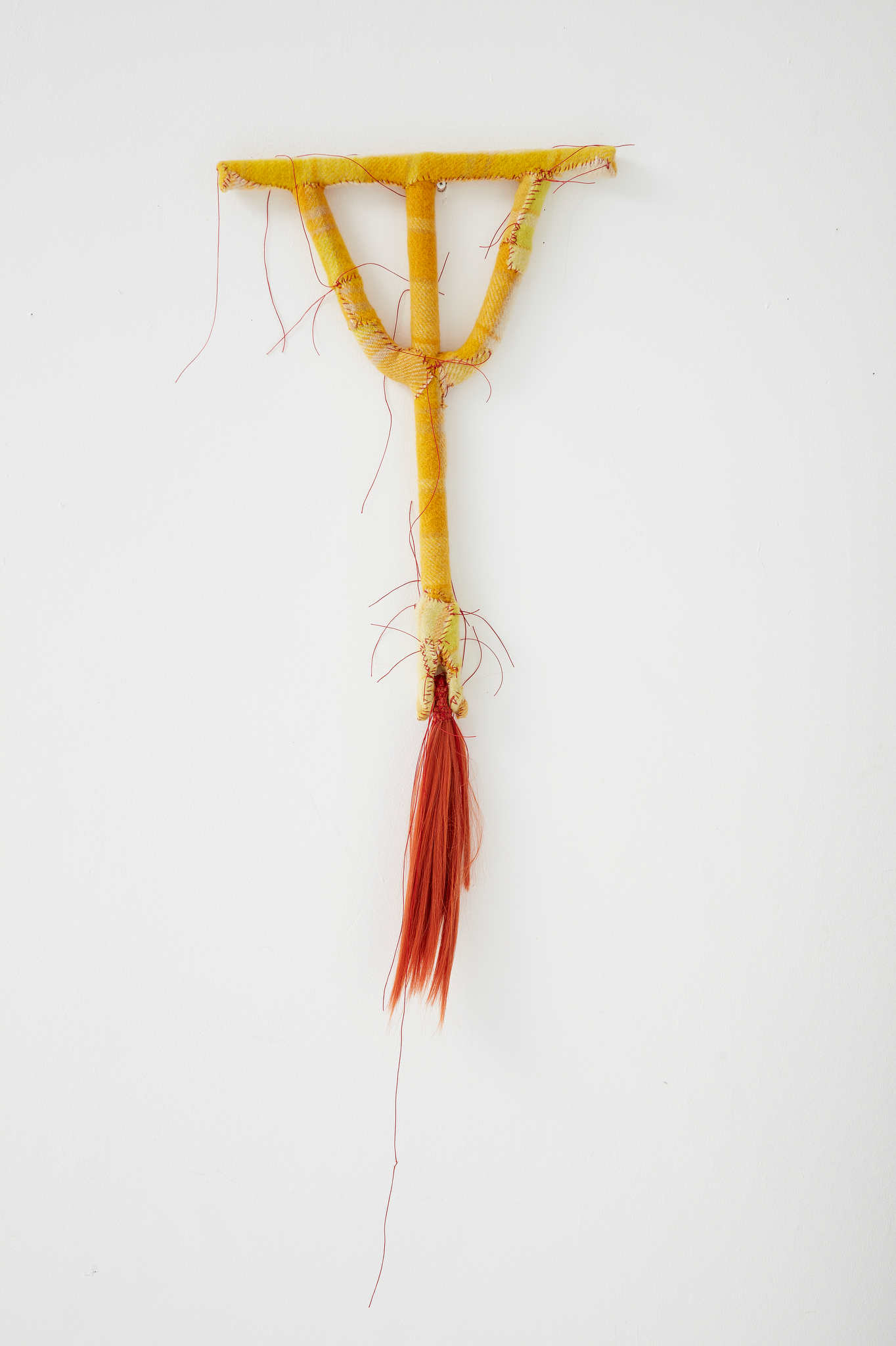 Olga Cironis, Dipping, 2022, repurposed tool, woollen blanket, cotton thread and synthethic hair, 82 x 40 x 4cm