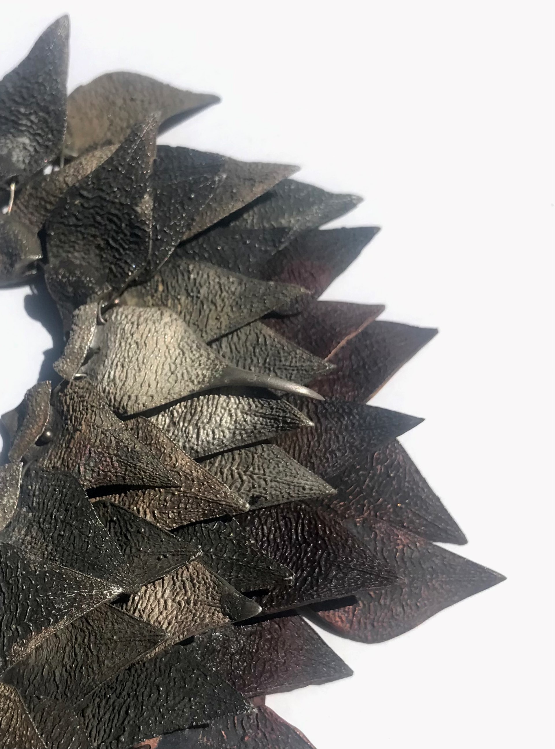 Sarah Elson, Allelopathic Chain 3 (Stapelia flower petals) (detail), 2022, recycled silver and copper, 8 x 39 x 4cm