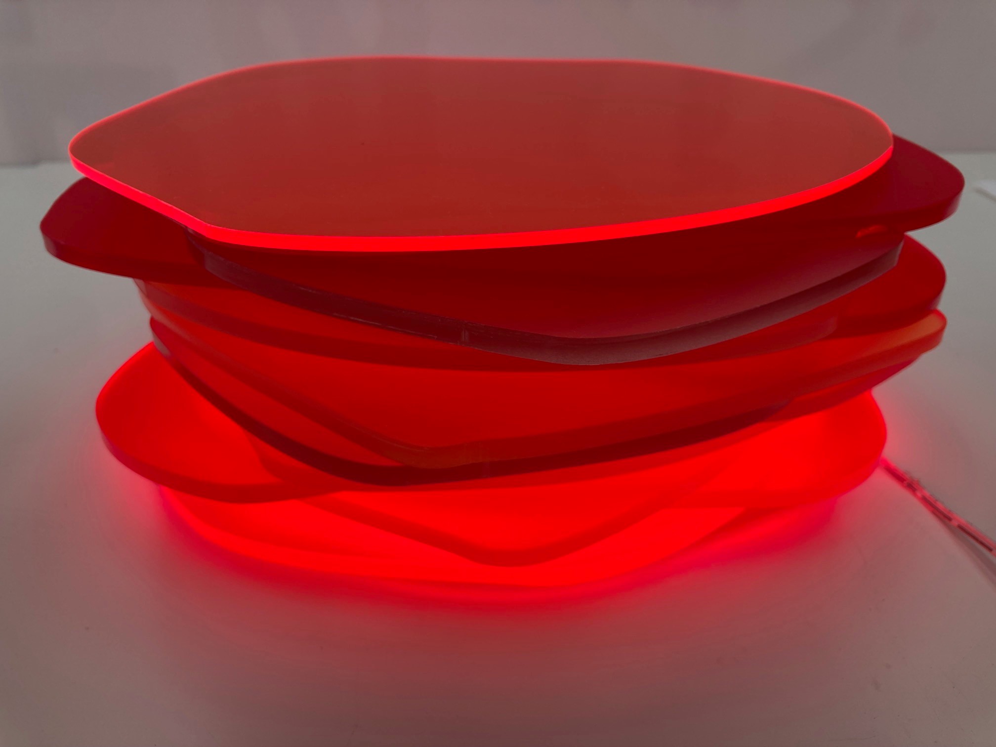 Pamela Gaunt, Fandango II (Illuminated Horizontal Stack), 2023, laser-cut and assembled Plexiglass and Perspex off-cuts from Not Quite Wabbly and vinyl tape, 11 x 25 x 25cm