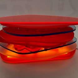 Pamela Gaunt, Fandango III (Illuminated Horizontal Stack), 2023, laser-cut and assembled Plexiglass and Perspex off-cuts from Not Quite Wabbly and a public art project, and vinyl tape, 11 x 25 x 25cm