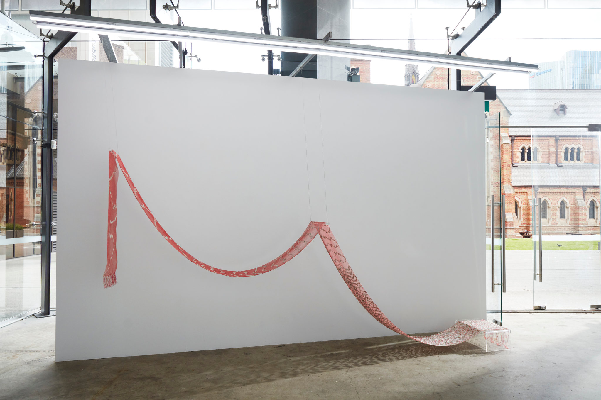 Jacky Cheng, Thrums, 2023, nylon, paper, thread, Chinese calendar, Tyvek and joss papers, 630 x 37cm. Acorn Photo