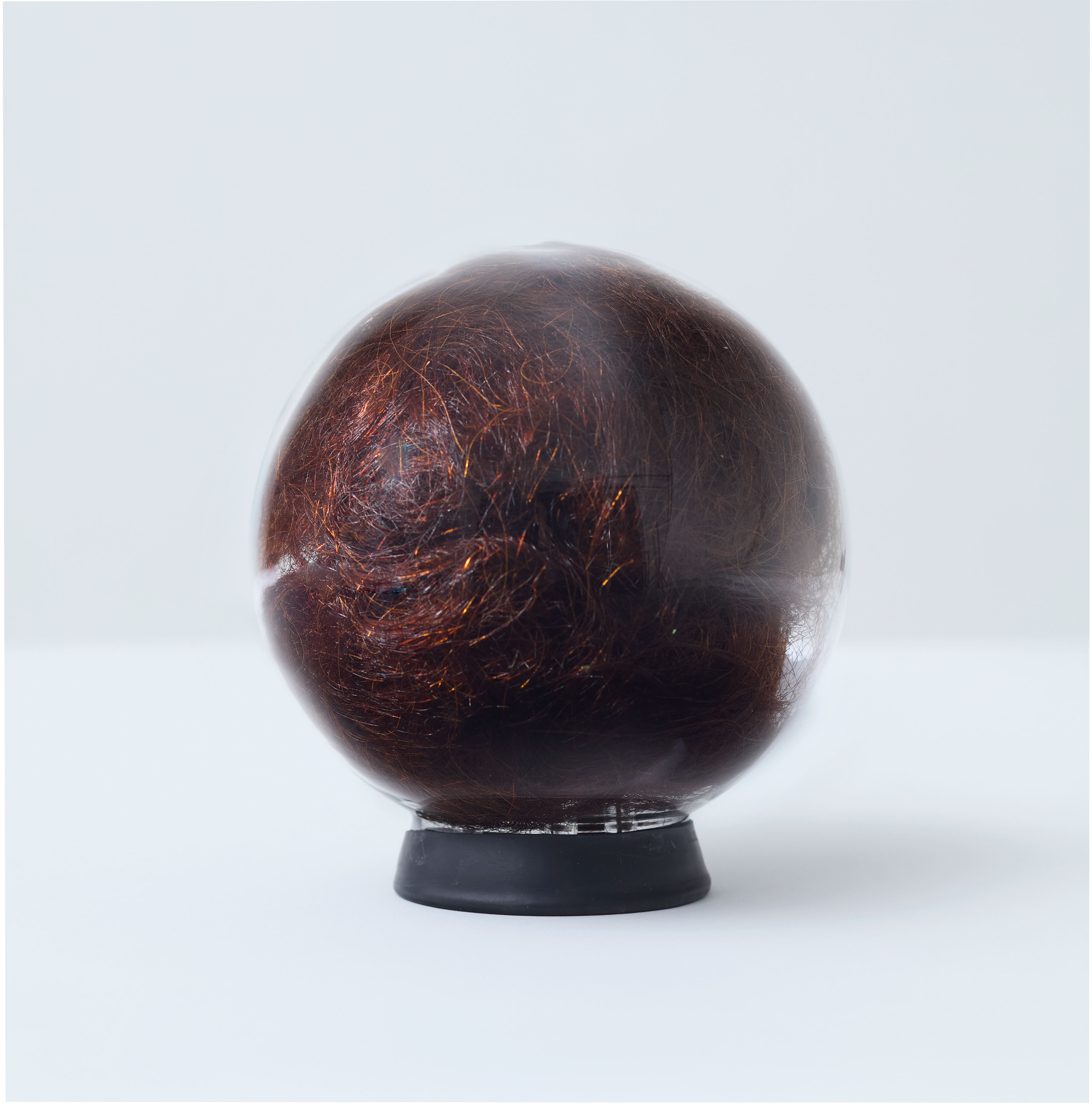 Olga Cironis, What's Mine is Yours, 2023, repurposed crystal ball and hair