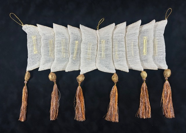 Jacky Cheng, Forms of Becoming, 2025, paper and gold leaf thread, wool, metal foil, gold Cricula silk cocoons, natural silk dyed thread, 35 x 50cm