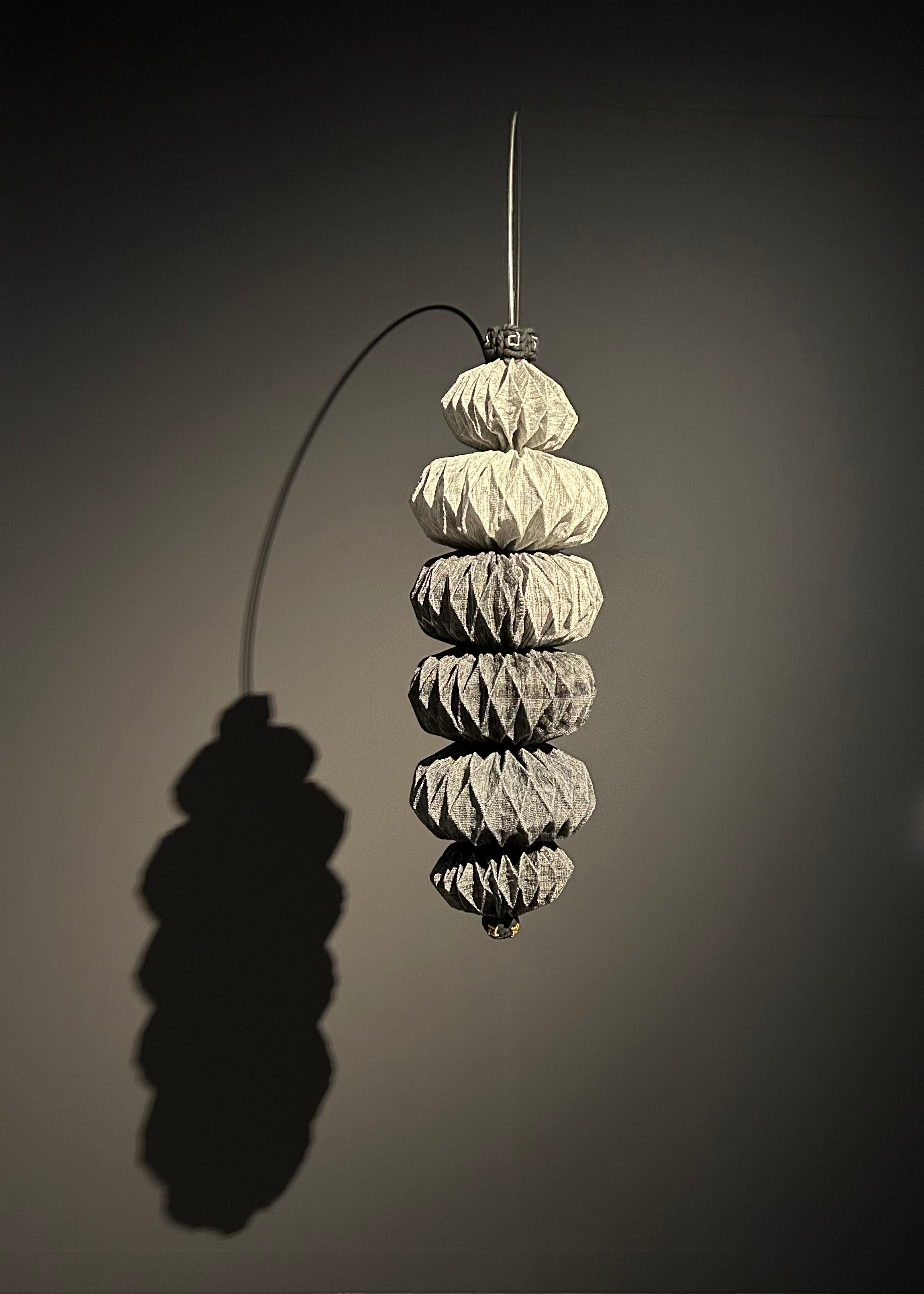 Jacky Cheng, Cicada, 2024, Kozo paper, gold, silver, linen thread, cotton thread, wool, black cotton rope and stainless steel hanging rod, 80 x 30 x variable