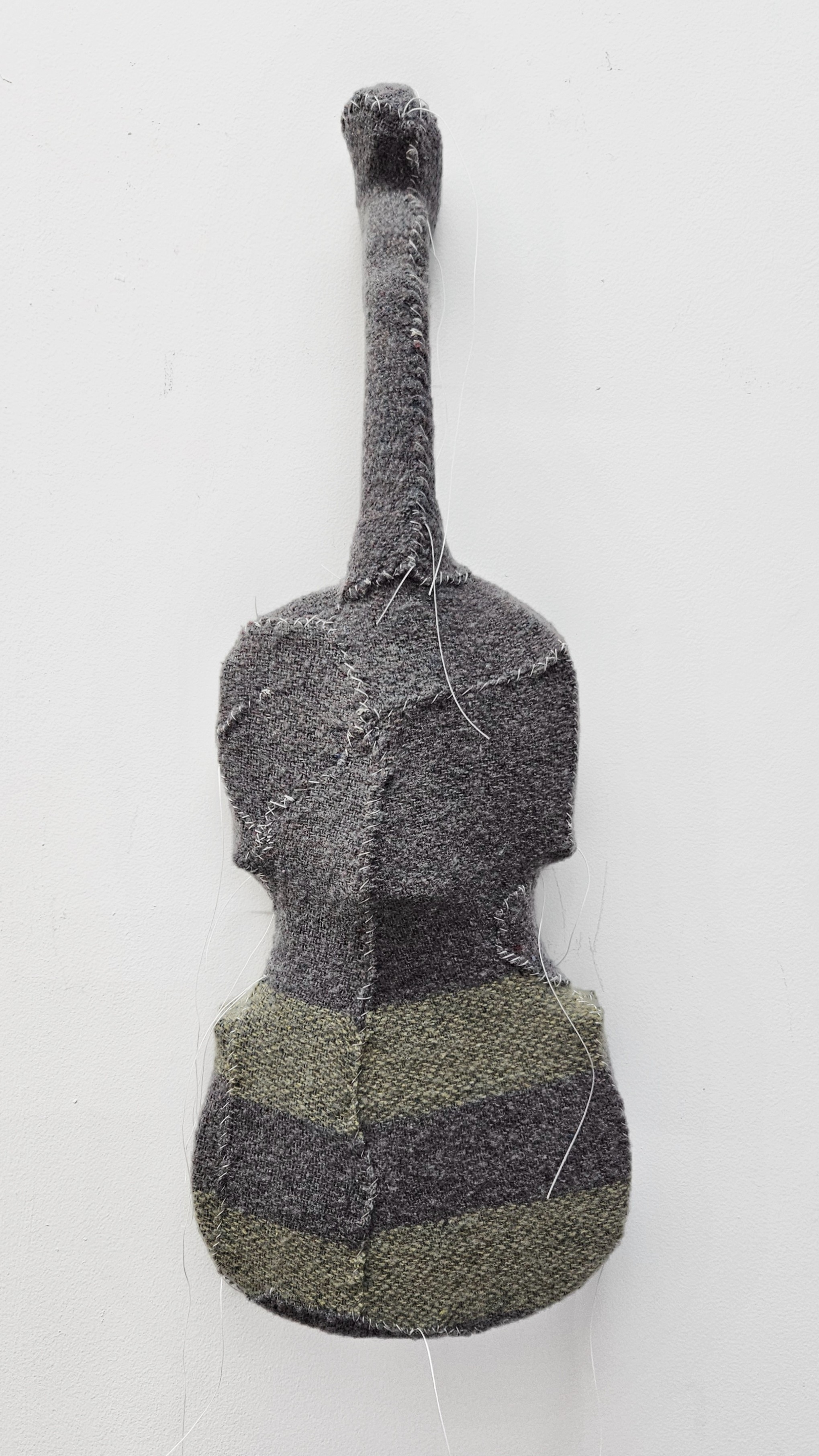 Olga Cironis, Holding #4, 2025, violin, woollen blanket and cotton, 55 x 20 x 4cm